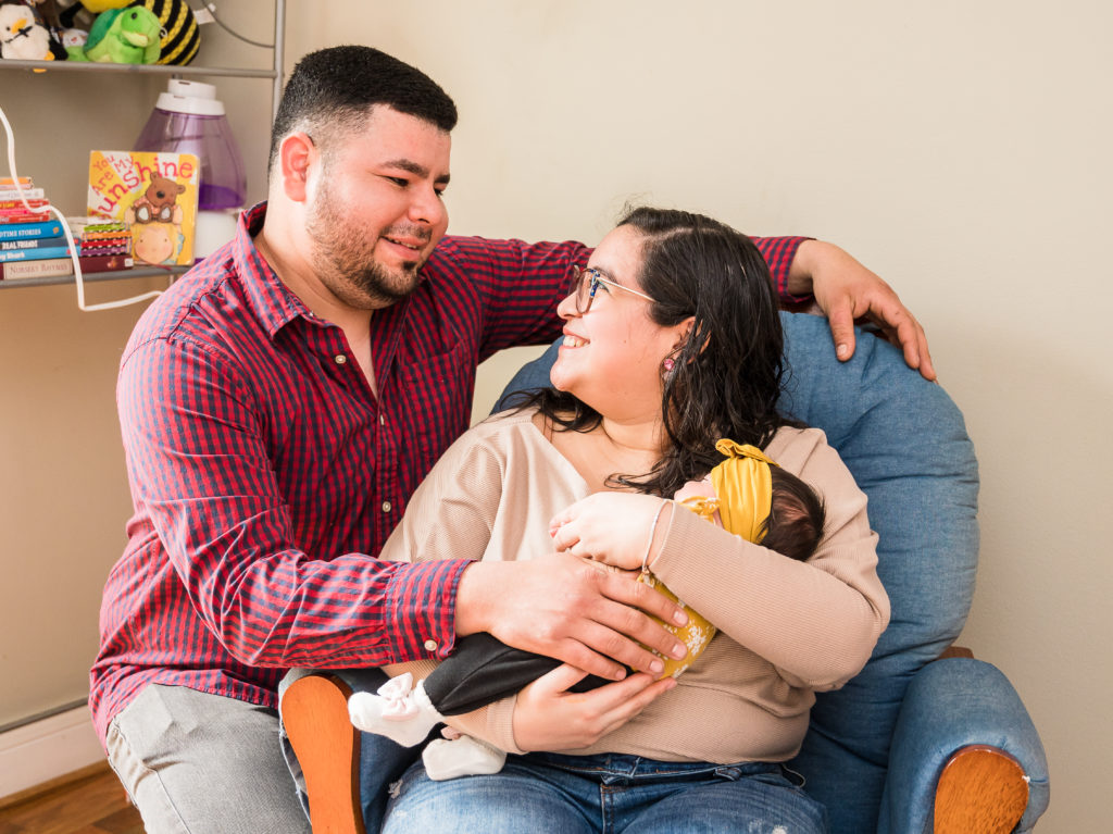 newborn and parents in home session